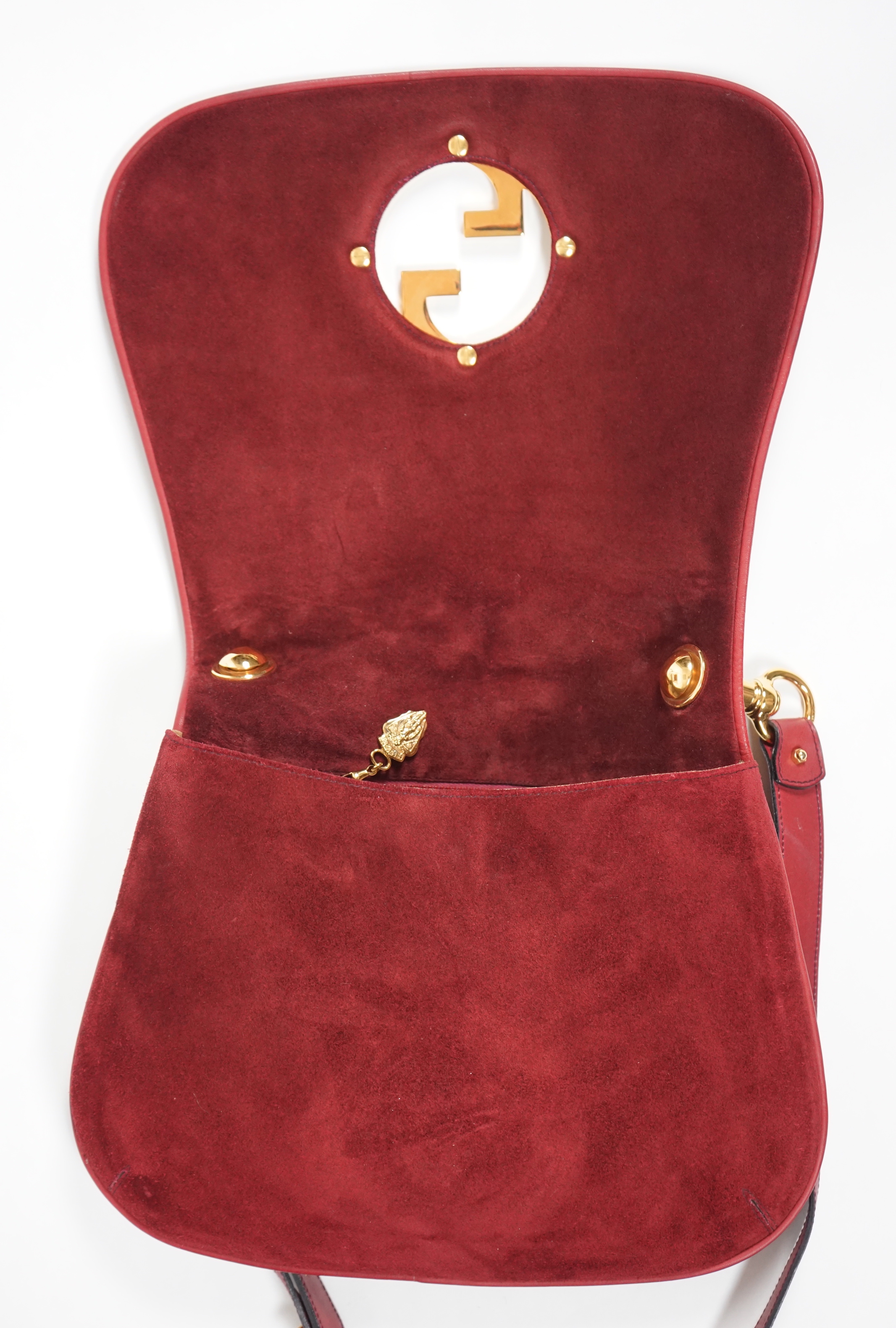 A vintage Gucci Blondie claret suede shoulder bag, width 29.5cm, max height 25cm, overall height 63cm to top buckle hole